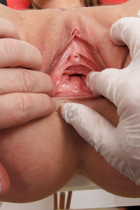 Graceful blonde sweetie in black stockings features in this gyno fetish scene