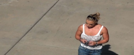 Oblivious busty Karmen Jay's big tits captured in downblouse voyeur photos