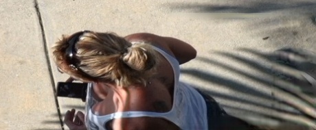 Oblivious busty Karmen Jay's big tits captured in downblouse voyeur photos