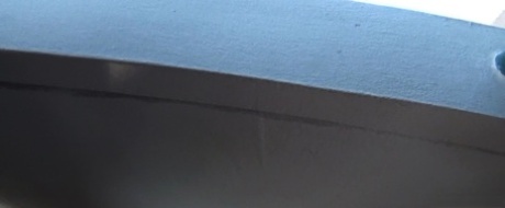 Oblivious busty Karmen Jay's big tits captured in downblouse voyeur photos