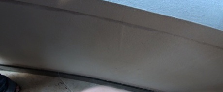 Oblivious busty Karmen Jay's big tits captured in downblouse voyeur photos