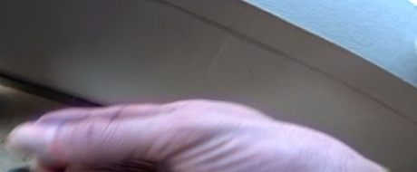 Oblivious busty Karmen Jay's big tits captured in downblouse voyeur photos