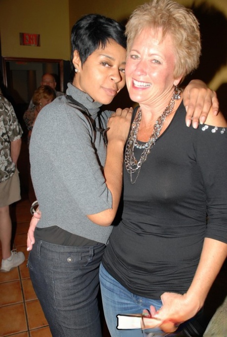 Horny granny enjoying some interracial sex fun at a steamy swingers orgy