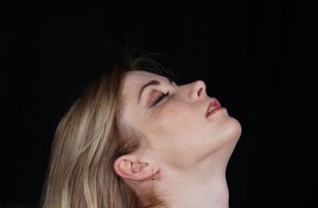 Naked blonde finds her nipples sticking out as she struggles against rope ties