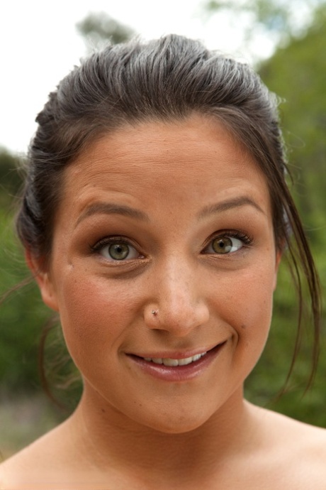 Brunette female Charity Bangs exposes her big boobs and butt while camping