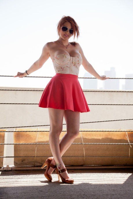 Stunning redhead Lilith Lust flashes her panties in daring Chinatown upskirt