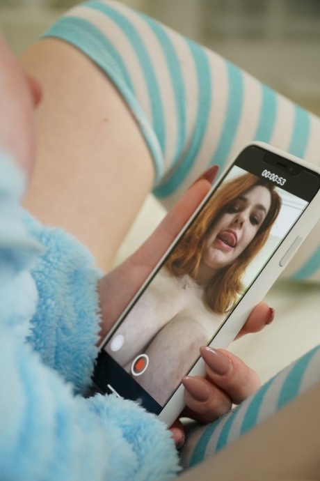 Redhead babe Annabel Redd shows her big tits and blows stiff prick in her room