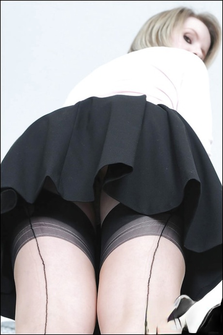 Sexy MILF in stockings doing upskirt and uncovering her big tits