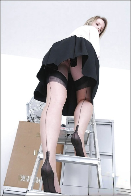 Sexy MILF in stockings doing upskirt and uncovering her big tits