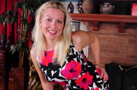 Blonde American housewife strips to black lingerie and stockings