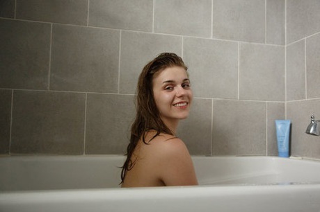 Big boobed brunette teen Natalie Austin takes a bath after eating pizza