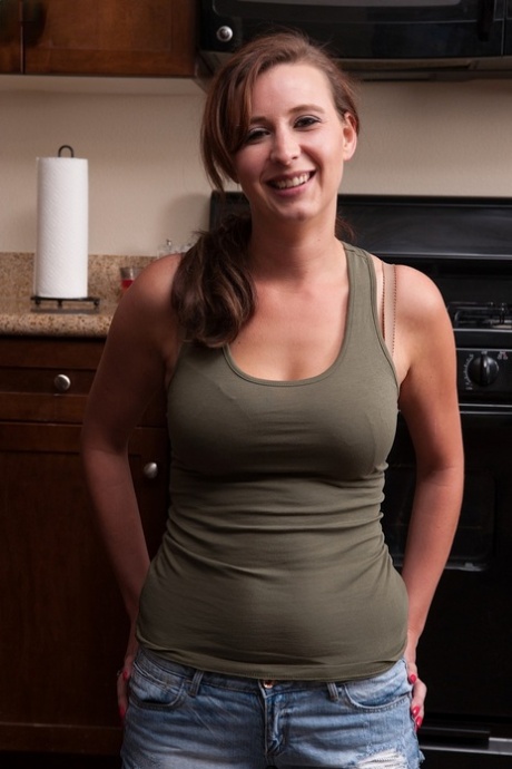 Middle-aged lady Alice Chambers uncovers her big natural tits as she disrobes