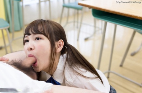 Tiny Asian schoolgirl gets cum on her tongue while sucking her teacher's cock