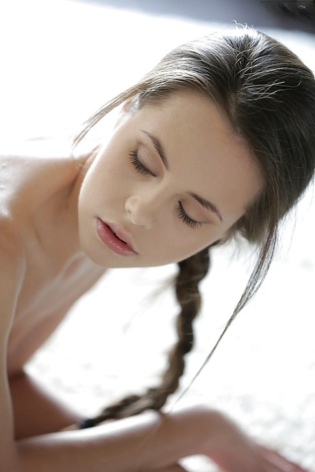 Beautiful solo babe Abril showing off her great legs in underthings