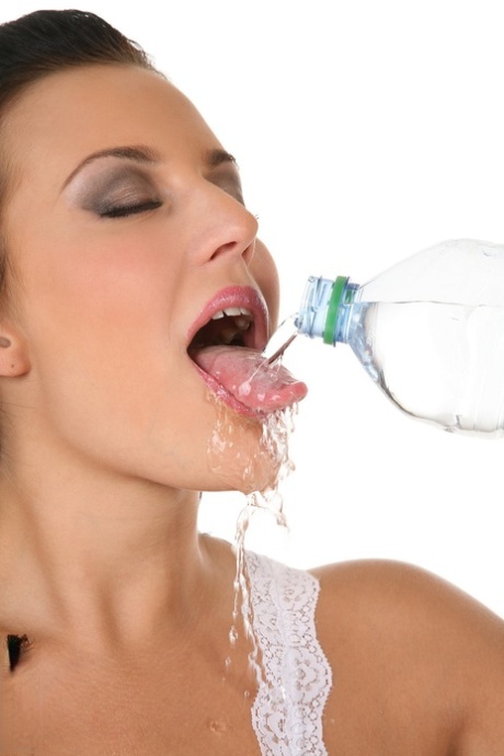 Hot brunette Carmen Croft pours water over enhanced tits and her pussy as well