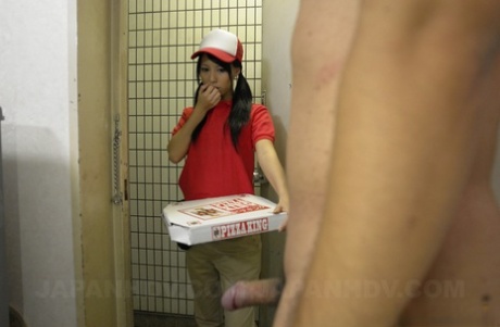 Japanese pizza delivery girl Miku Oguri is greeted at door by a hard cock