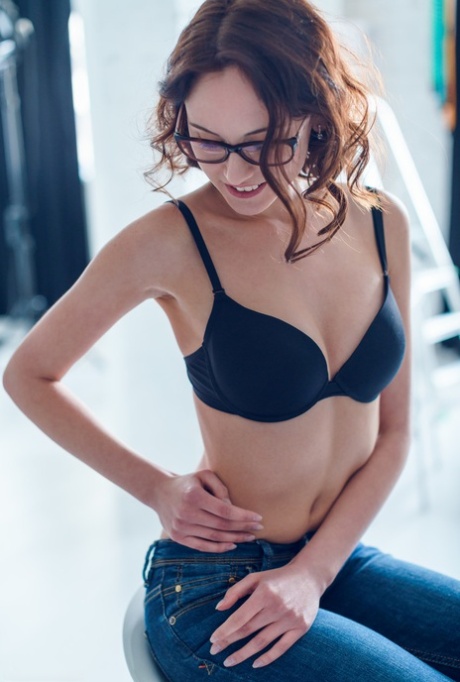 Glasses clad Sade Mare sheds sexy black lingerie to show small natural tits