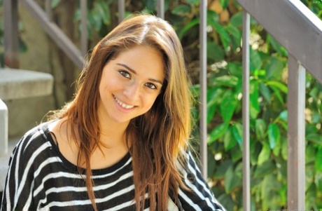 Skinny young girl goes topless out in the street before getting totally naked