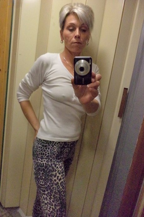 Czech lady Kathy White taking selfies in the mirror while stripping