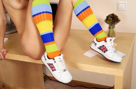 Solo girl Dasha gets naked in multi-colored knee socks and sneakers
