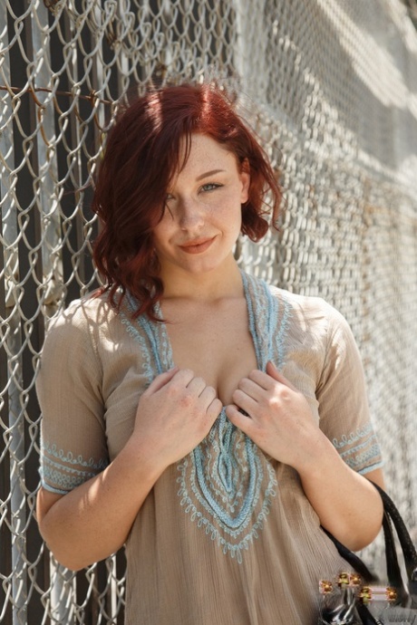 Natural redhead Spencer Bisson pulls down her panties after getting in a car