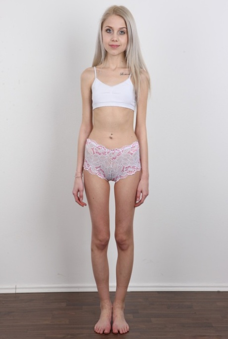 Skinny 18 year old virgin Natalia takes off her clothes to stand in the nude