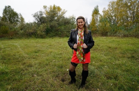 Horny granny Eva Jayne gets cum on her face after a gangbang in a field