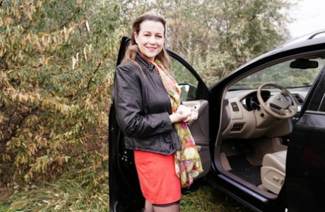 Horny granny Eva Jayne gets cum on her face after a gangbang in a field