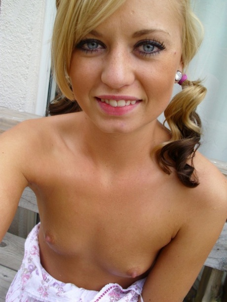 Pretty blonde Tiny Tiff shows her teensy tits & flashes a naked upskirt
