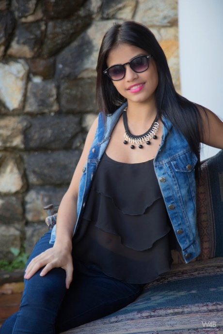 Brazen Denisse Gomez hangs out on the patio in sheer pantyhose and white thong