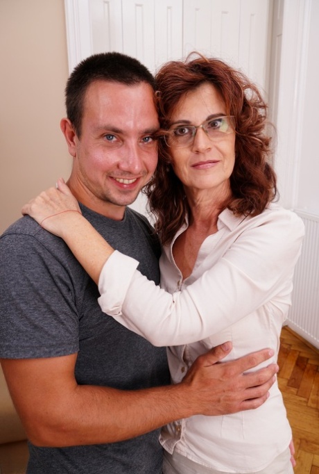 Mature lady gets hot and horny and calls in her young stud for a fuck session