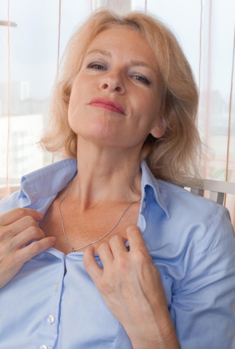 Mature lady with blonde hair Diana Douglas stretches out her hairy snatch