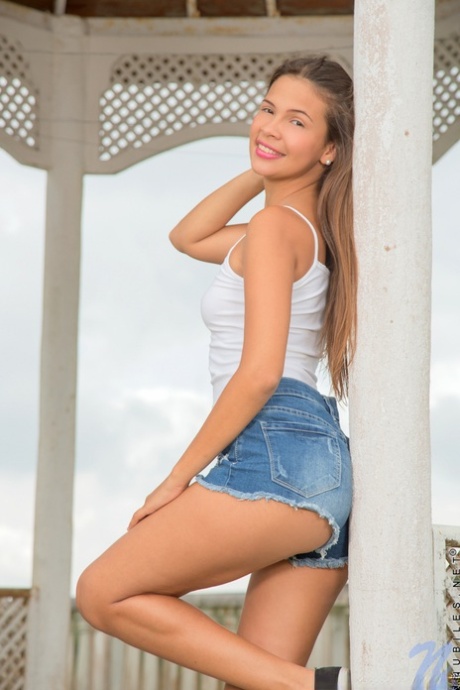 Sweet teen Kiara Lorens sheds shorts & shirt to spread pussy lips outdoors