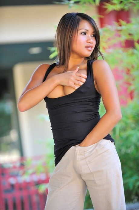 Adorable Asian sweetie Annie Lee flashes her big juggs and her twat