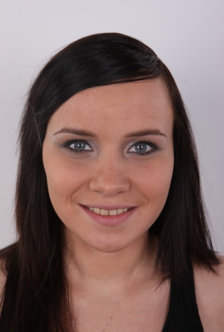 First timer with brunette hair uncovers her pierced pussy after getting naked