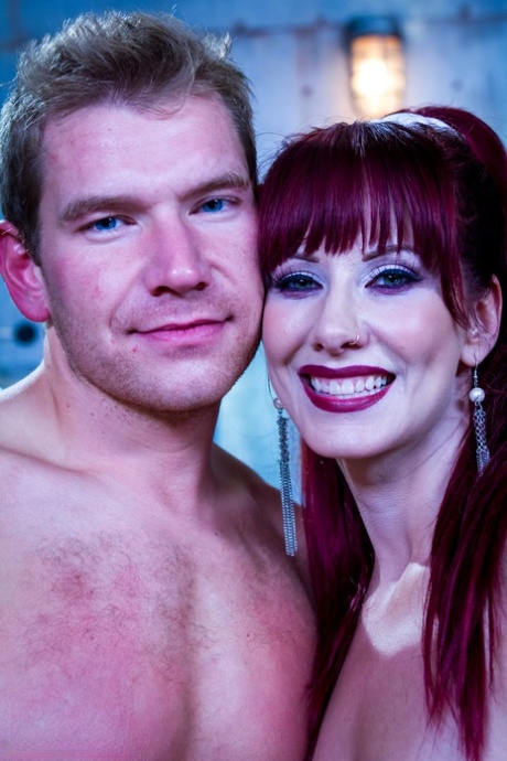 Redhead domme Maitresse Madeline Marlowe slides a strapon in a guy's butthole