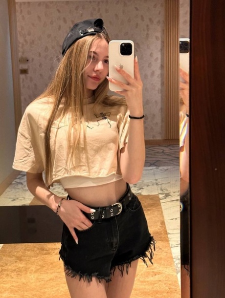 Charming blonde teen Katya Sun takes numerous self shots in SFW mode