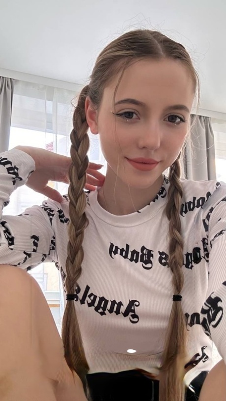 Charming blonde teen Katya Sun takes numerous self shots in SFW mode