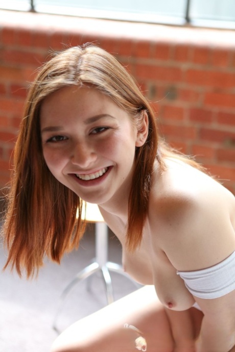 Beautiful teen with big ass Lulu Reynolds unveils her tiny tits and red thongs