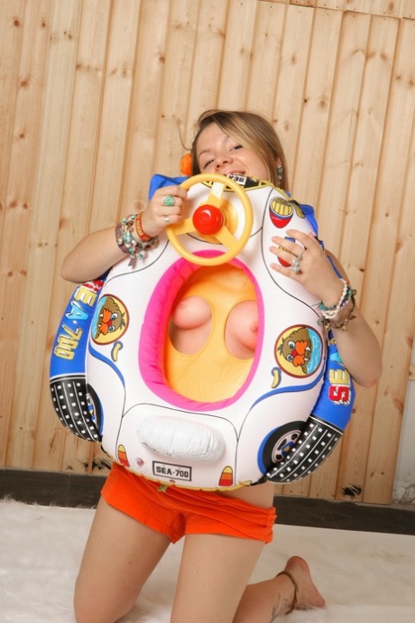 Charming young girl strips down to a thong during barefoot solo action