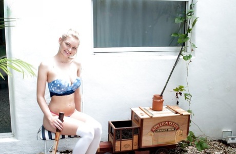 Young blonde girl Alli Rae fingering asshole in the woods in knee socks