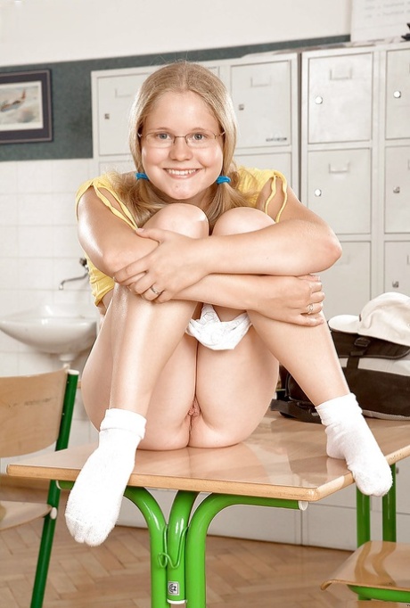 Chubby teen girl in glasses getting naked right in classroom