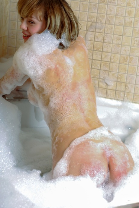 Naked babe Karen A shows her beautiful breasts & her bald cunt in the bathroom