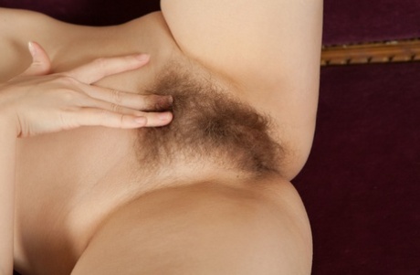 Beautiful Alice N posing nude and exposing her super furry pussy