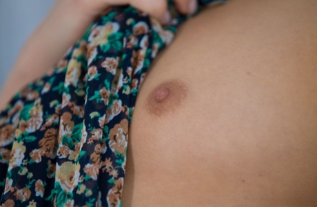 Sensual sweet teen Peggy bares her flat chest posing naked in the window