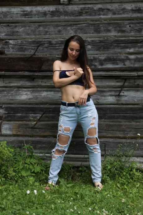 Beautiful babe Nicole V flaunts her big ass in a sexy outdoor striptease