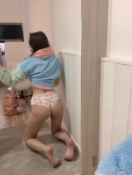 Blue-eyed OnlyFans model Little Kitty shows her perky tits & round ass