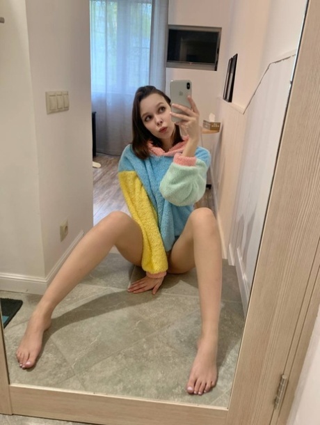 Blue-eyed OnlyFans model Little Kitty shows her perky tits & round ass