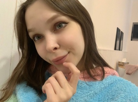 Blue-eyed OnlyFans model Little Kitty shows her perky tits & round ass