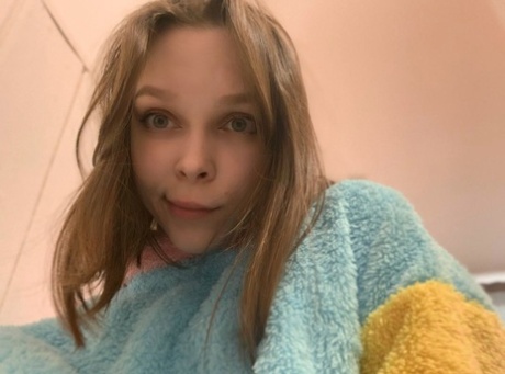 Blue-eyed OnlyFans model Little Kitty shows her perky tits & round ass